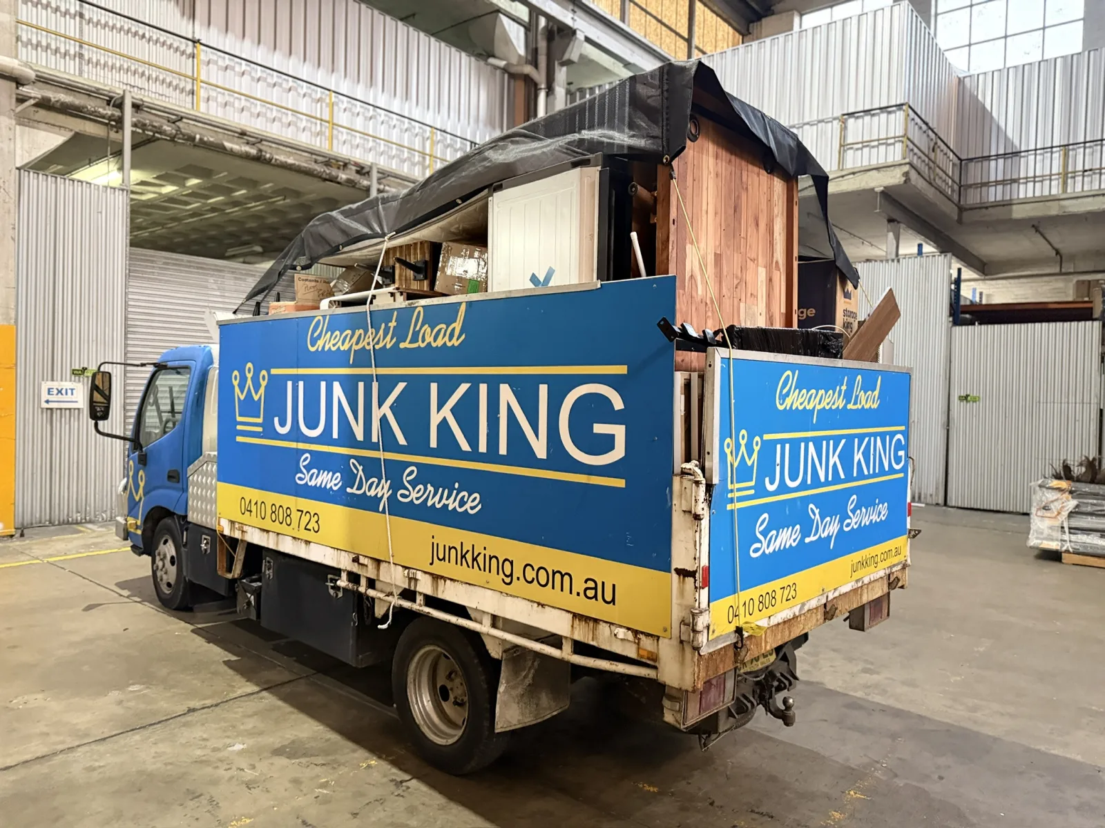 Junk King truck loaded with rubbish from the rear