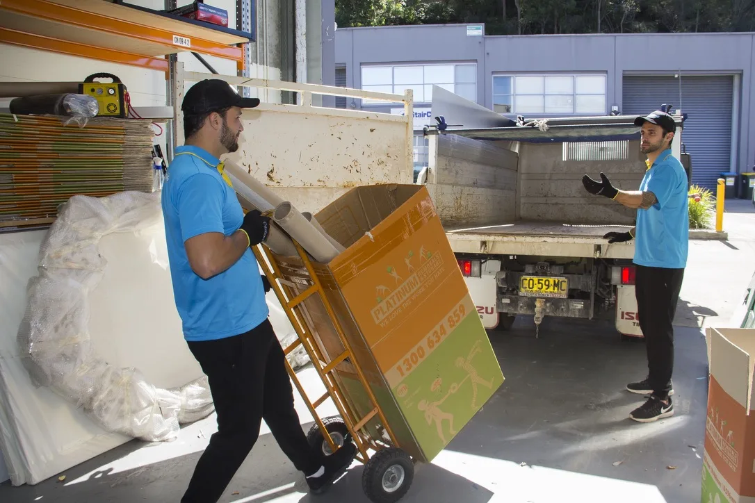 Junk King crew loading commercial rubbish into a truck