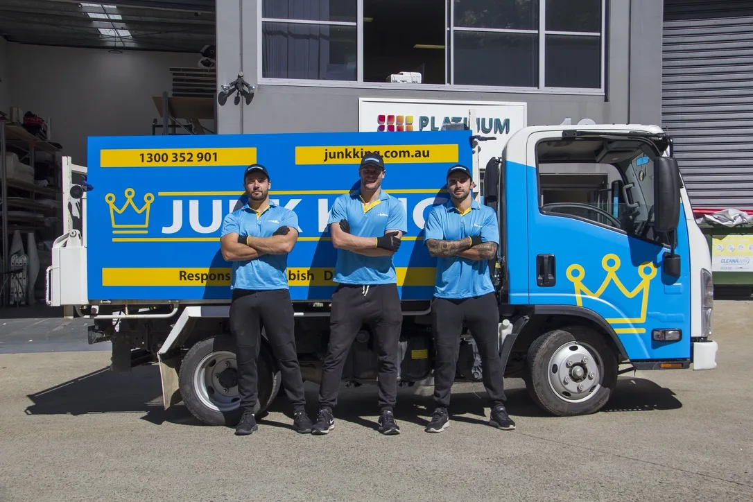 Junk King Sydney crew standing with branded rubbish removal truck
