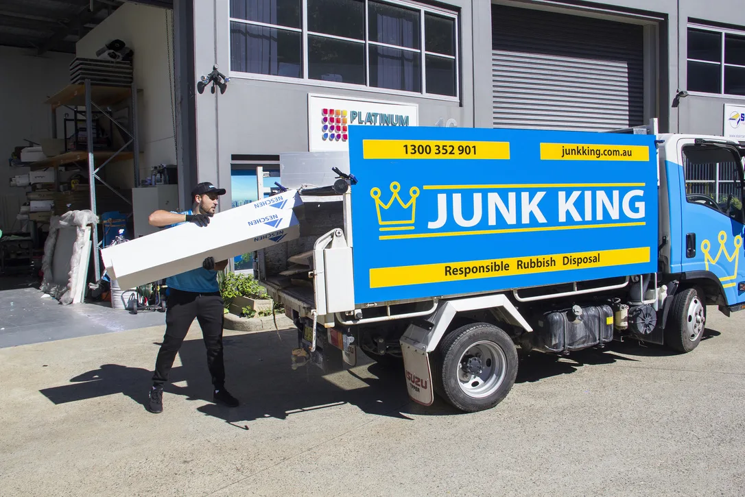 Junk King truck being loaded during a rubbish removal job